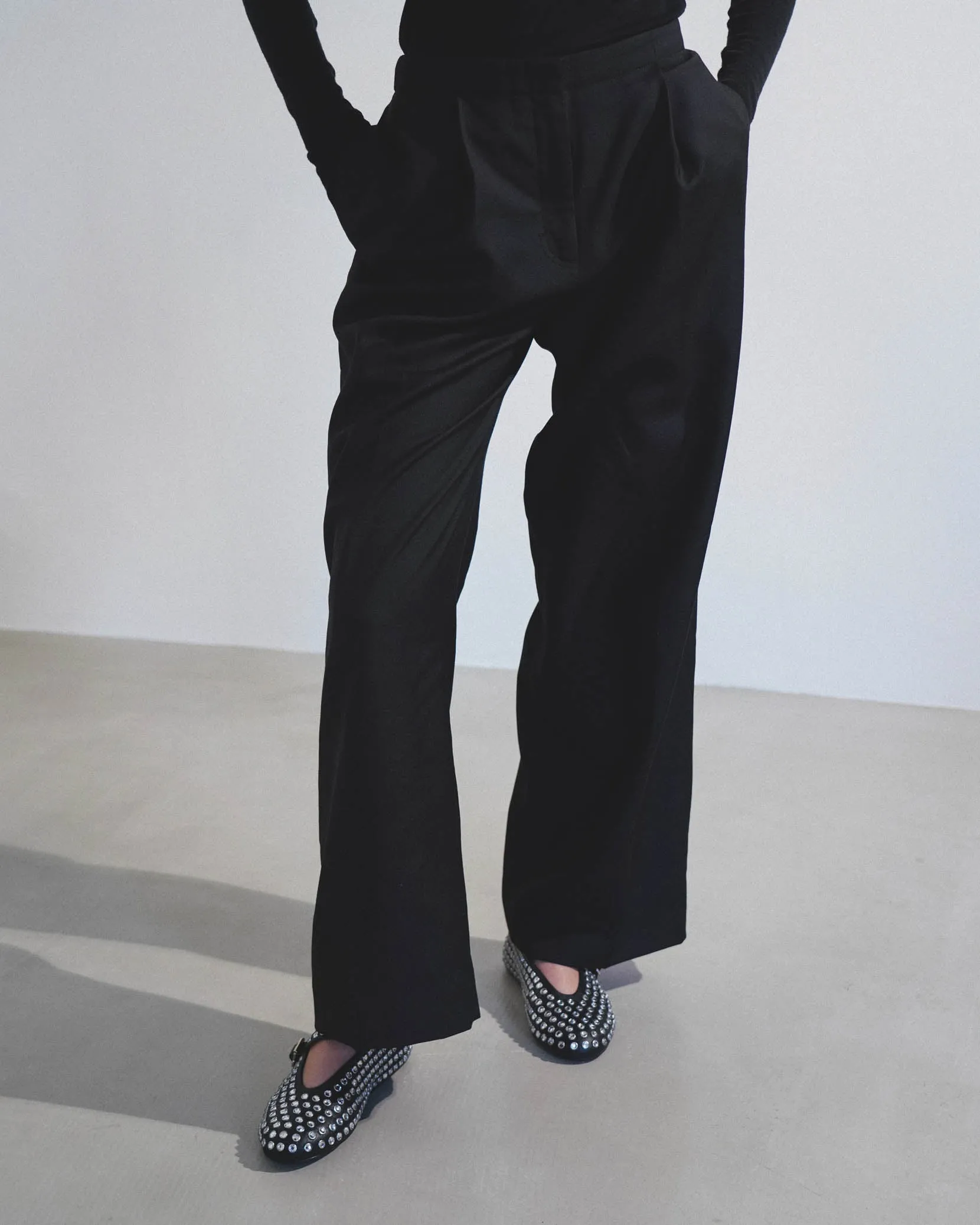 Embellished black leather ballet flats