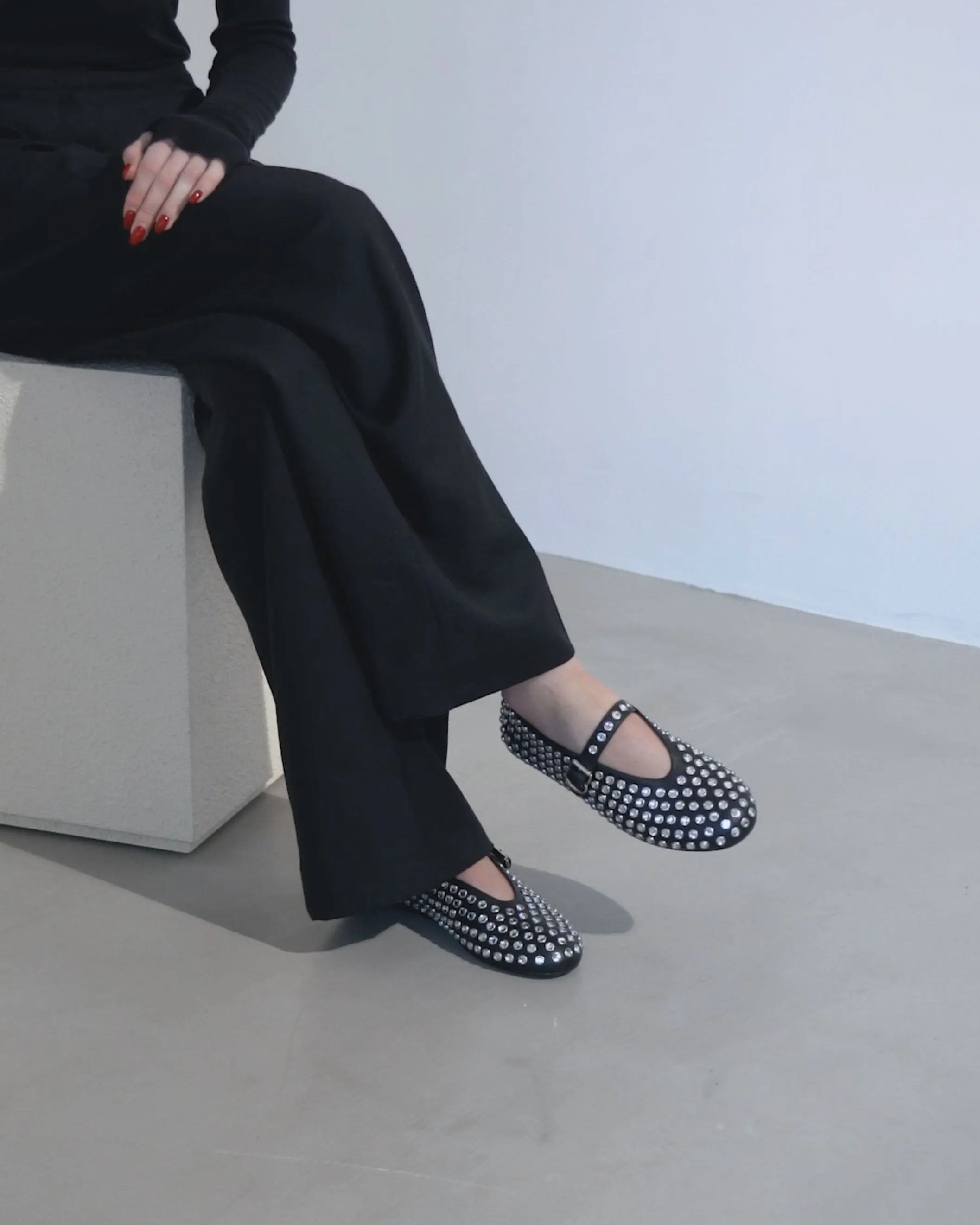 Embellished black leather ballet flats