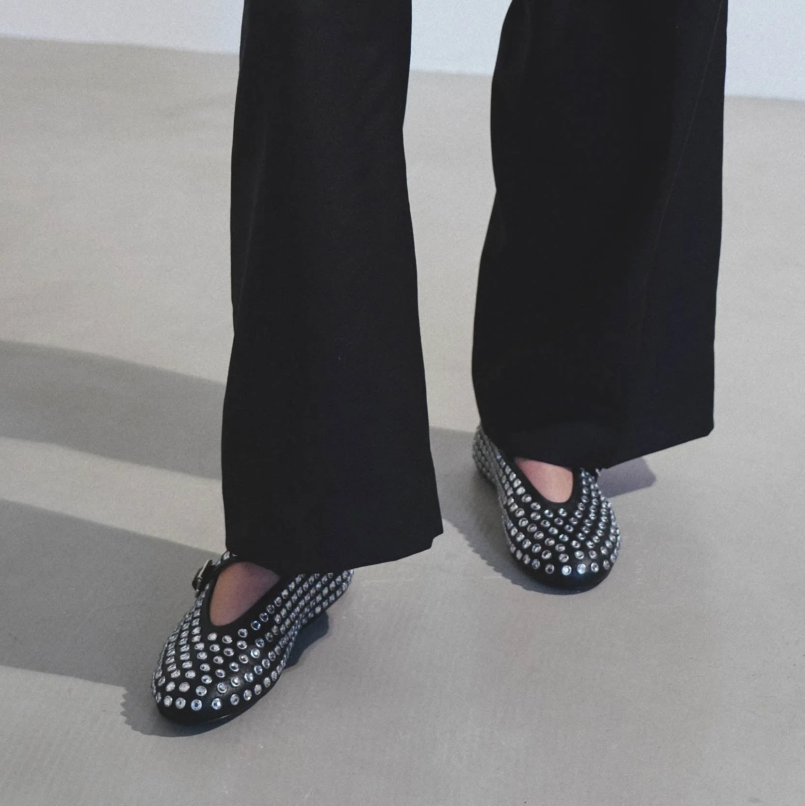 Embellished black leather ballet flats